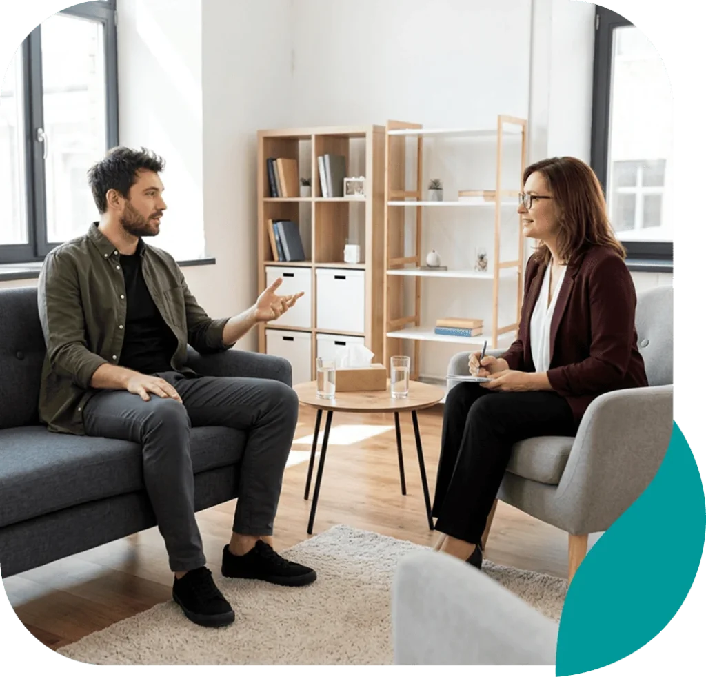 Young man talking with a therapist during a counseling session